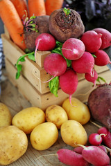 Wooden crate with fresh vegetables, closeup