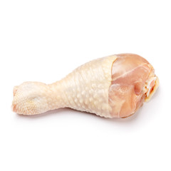 Raw chicken leg on a white background