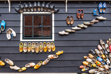 Clogs on a wooden house as decoration