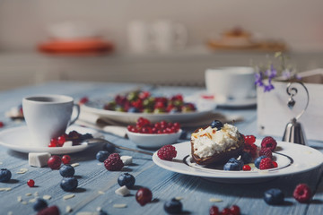 Breakfast with baked pea and berries at blue rustic wood