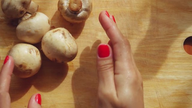 Cooking cutting mushrooms in the kitchen. 1920x1080