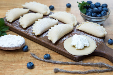 Dumplings with cottage cheese and blueberry