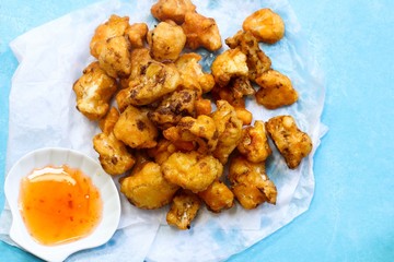 Cauliflower Fritters / Batter fried cauliflower florets, selective focus