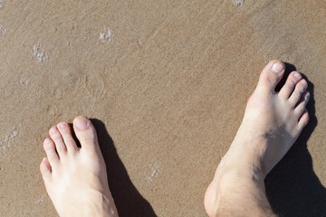 Leg on sea sand