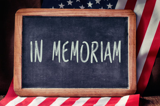 text in memoriam and flag of the United States