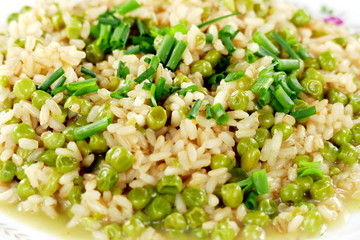 Rice with peas and chives on plate