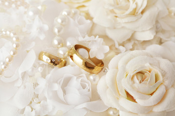 wedding rings, pearls and flowers