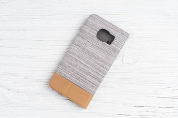Cover for smart phone on rustik wooden background