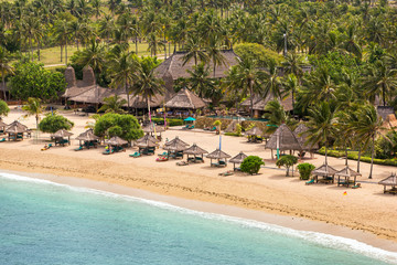 Naklejka premium Tropical resort on Kuta sand beach, Lombok, Indonesia
