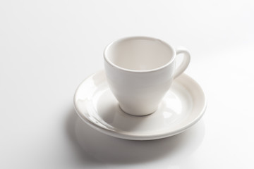 Empty coffee cup or tea cup on the white table