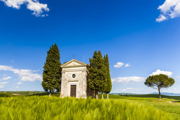 Tuscany landscape with a little chapel of Madonna di Vitaleta, San Quirico d'Orcia, Italy