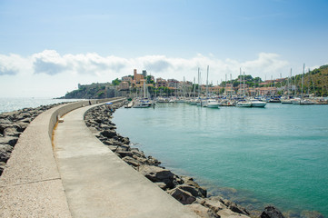 Talamone village in Italy, view from long harbor dock
