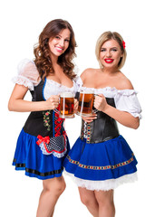 Two beautiful blond and brunette girls of oktoberfest beer stein