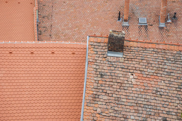 Roof orange shingles with chimney