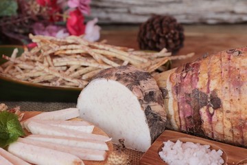 Fresh taro and taro stick with salt.