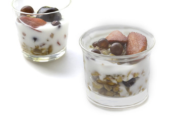 A food is yogurt and fruit.