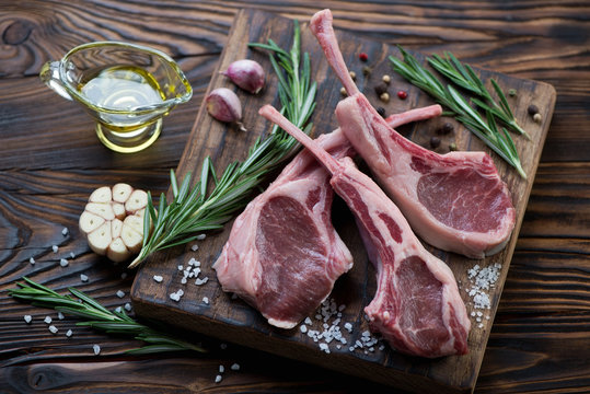 Fresh uncooked lamb shoulder rack steaks with seasonings
