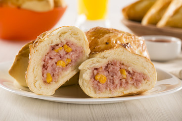 Brazilian snack fried with cheese ham on wooden background.