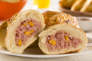 Brazilian snack fried with cheese ham on wooden background.