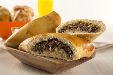 Brazilian snack. Meat Esfiha on the table