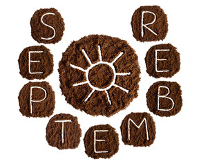 September and sun, decorated with ground coffee on white background