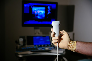 Ultrasonic investigation medical device for diagnostics in doctor hand. Hospital equipment
