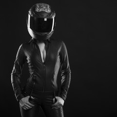  biker girl posing in studio in black background
