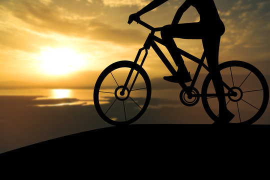 Silhouette of a man on muontain-bike, sunset