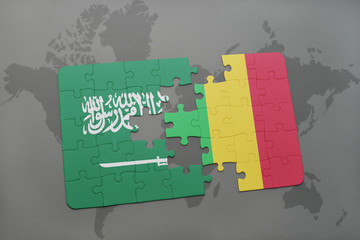 puzzle with the national flag of saudi arabia and mali on a world map background.