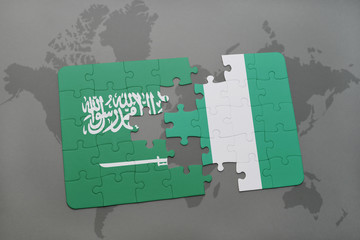 puzzle with the national flag of saudi arabia and nigeria on a world map background.