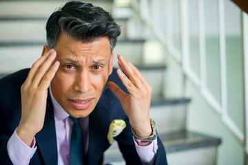 Worried and stressed businessman.