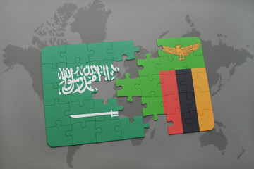 puzzle with the national flag of saudi arabia and zambia on a world map background.