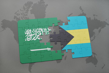puzzle with the national flag of saudi arabia and bahamas on a world map background.