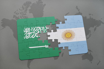 puzzle with the national flag of saudi arabia and argentina on a world map background.