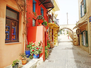 traditional street among bougainvillaea in rethymno city Greece