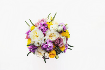 Bridal bouquet of white rose in bright colors isolated on white