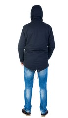 Back view of handsome man in winter jacket  looking up.   Standing young guy in parka. Rear view people collection.  backside view of person.  Isolated over white background. Man in warm jacket hood © ghoststone
