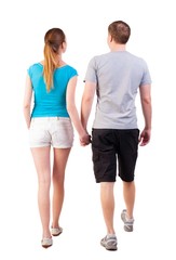 Back view of going young couple (man and woman). walking beautiful friendly girl and guy in shorts together. Rear view people collection.   backside view of person.  Isolated over white background
