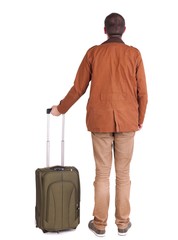 Back view of stylishly dressed man in a brown jackett with  suitcase looking up.   Standing young guy in jeans and  jacket. Rear view people collection.  backside view of person.  Isolated over white