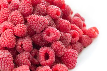 raspberries on white background - side view