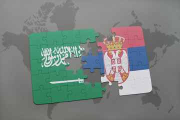 puzzle with the national flag of saudi arabia and serbia on a world map background.