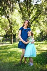 Fototapeta premium Happy mother and daughter together outdoors