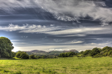 Fototapeta na wymiar Cloudscape over Green Pasture Field near Auchencairn HDR