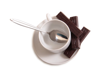 Coffee cup and chocolate on a white background