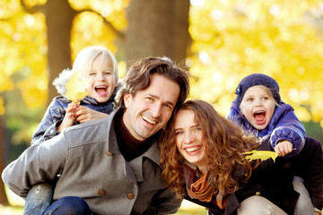Young family in autumn park