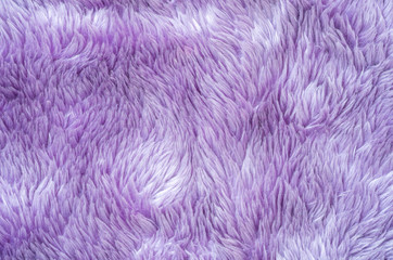 Closeup surface abstract fabric pattern at the purple fabric carpet at the floor of house texture background