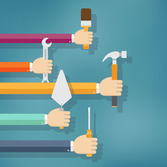 Hands holding housework and repair tools.