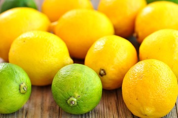 Organic lemons on a wooden background. Vintage style.