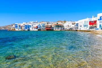 View of beach and Little Venice part of Mykonos town with colorful houses, Greece