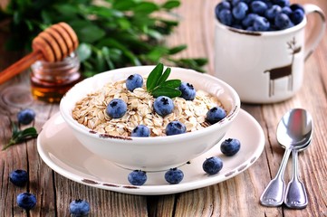 Oat flakes Quick cooking with blueberries. Healthy breakfast.